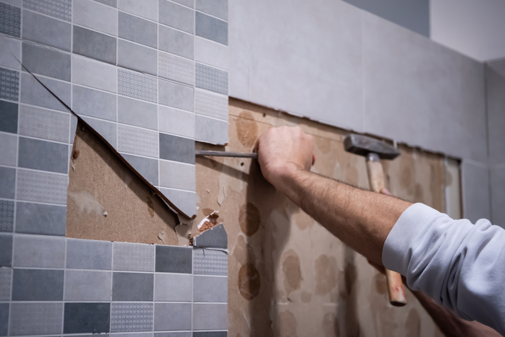 knock-off-bathroom-tiles-with-hammer-and-chisel